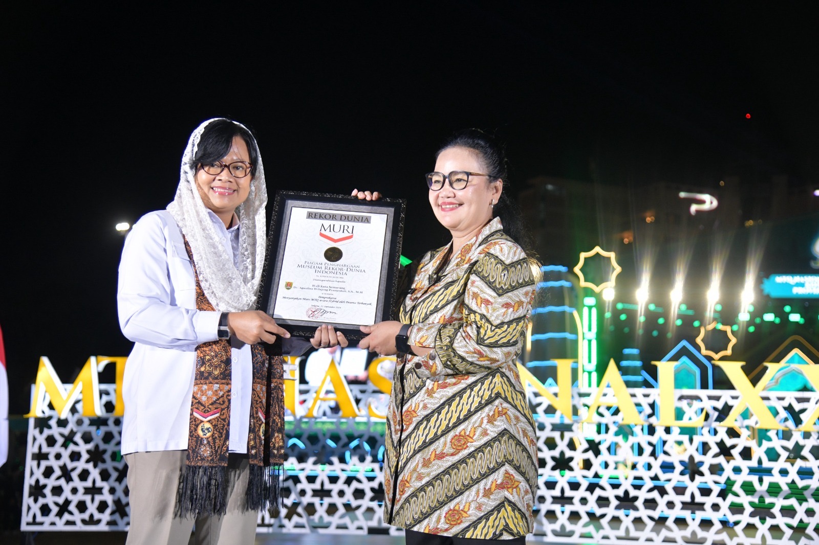 Pembukaan MTQ Nasional XXXI di Semarang pecahkan rekor MURI lewat Gema Mars yang diikuti 288.219 peserta. Walikota Agustina puji kerukunan warga.